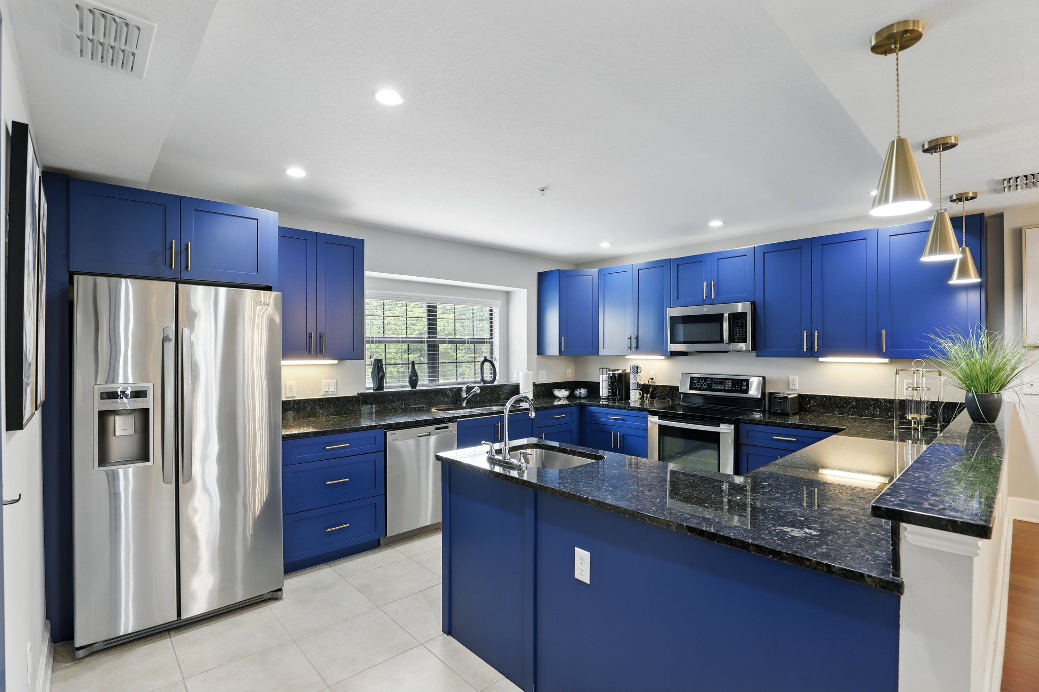 Designer kitchen with granite counters and stainless appliances
