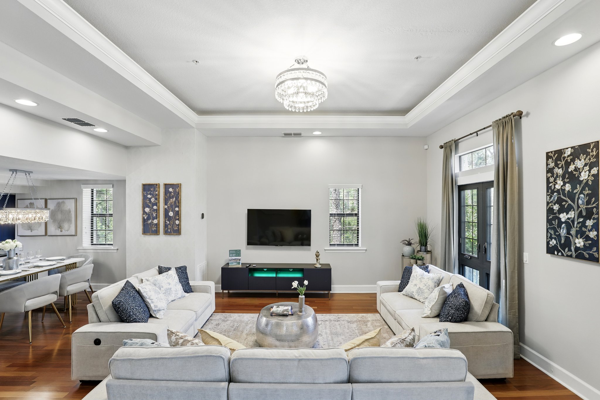 Open living area with chandelier