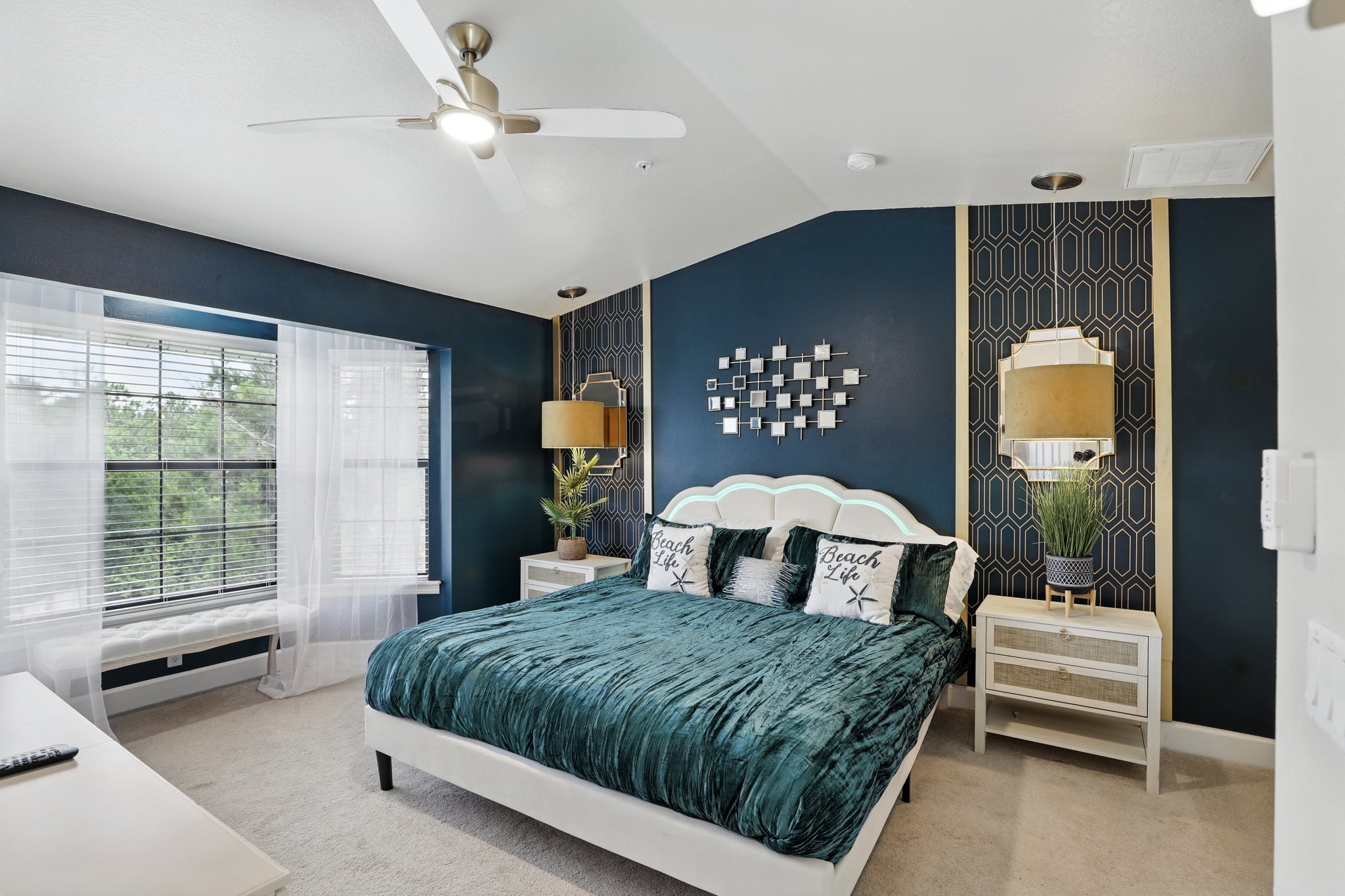 Master bedroom with navy accent wall
