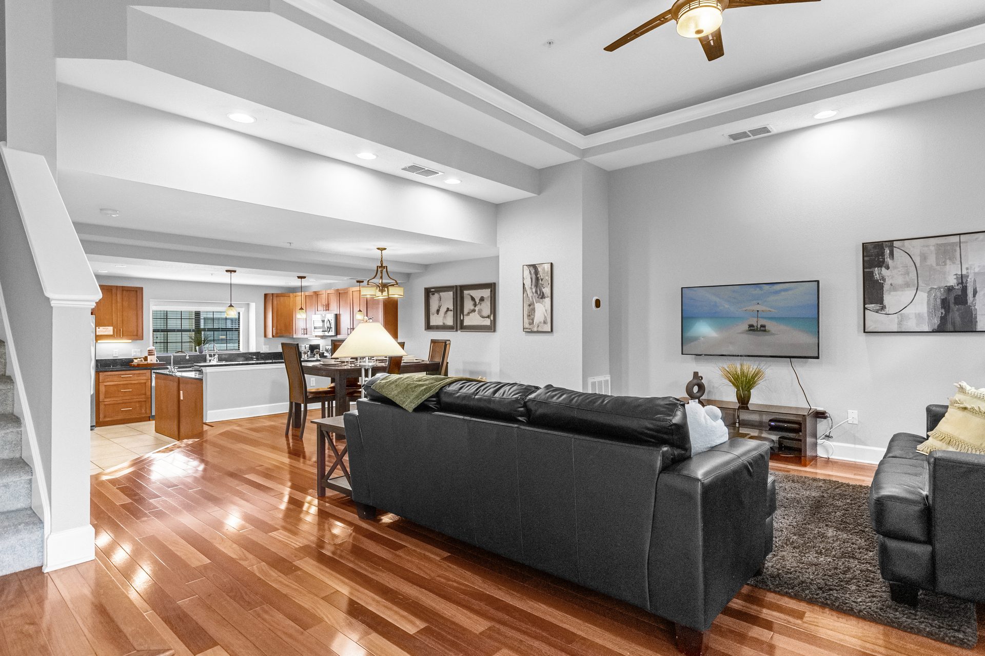 Open-plan living looking toward kitchen and staircase