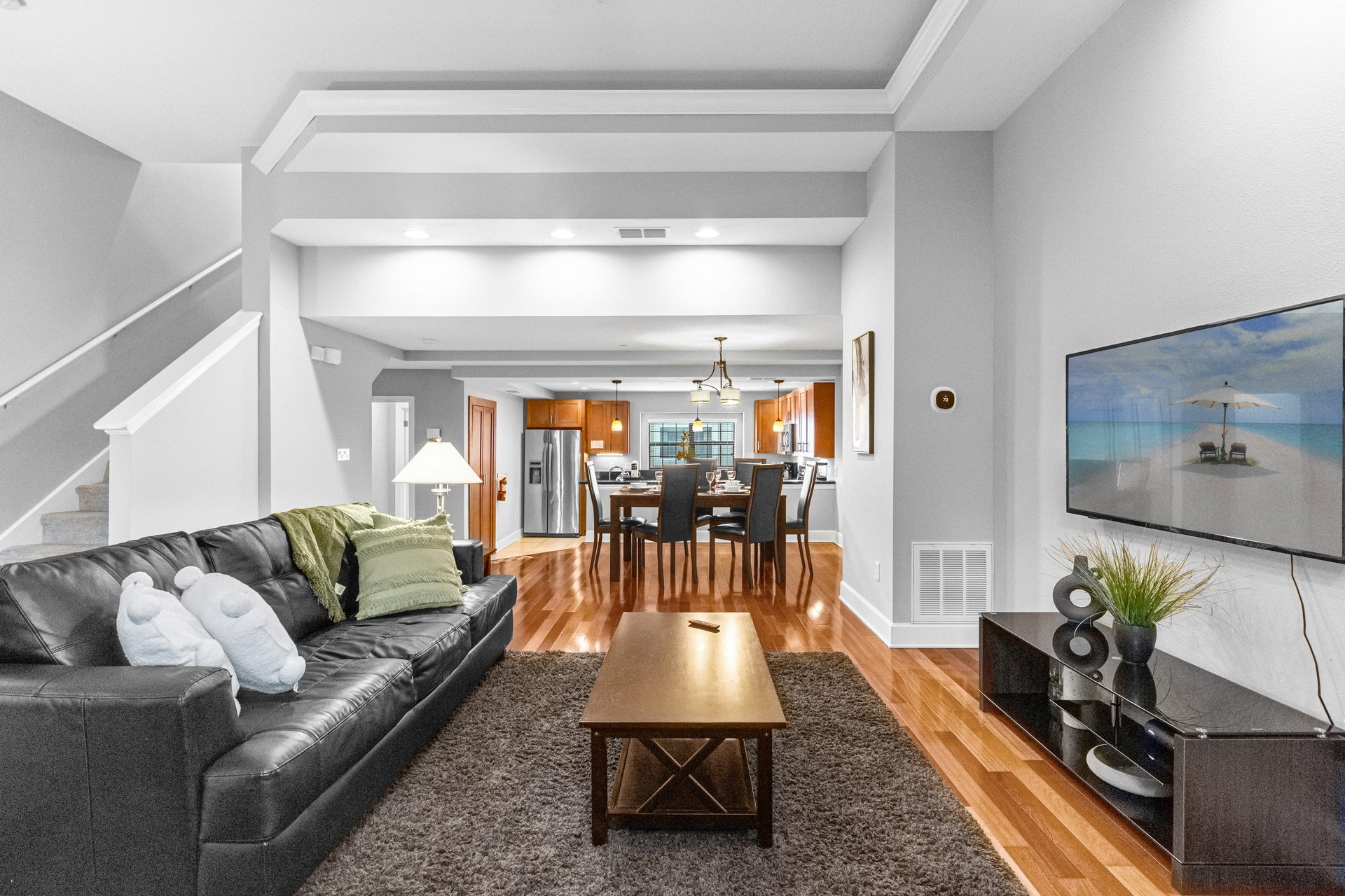 Living room looking into dining room and kitchen