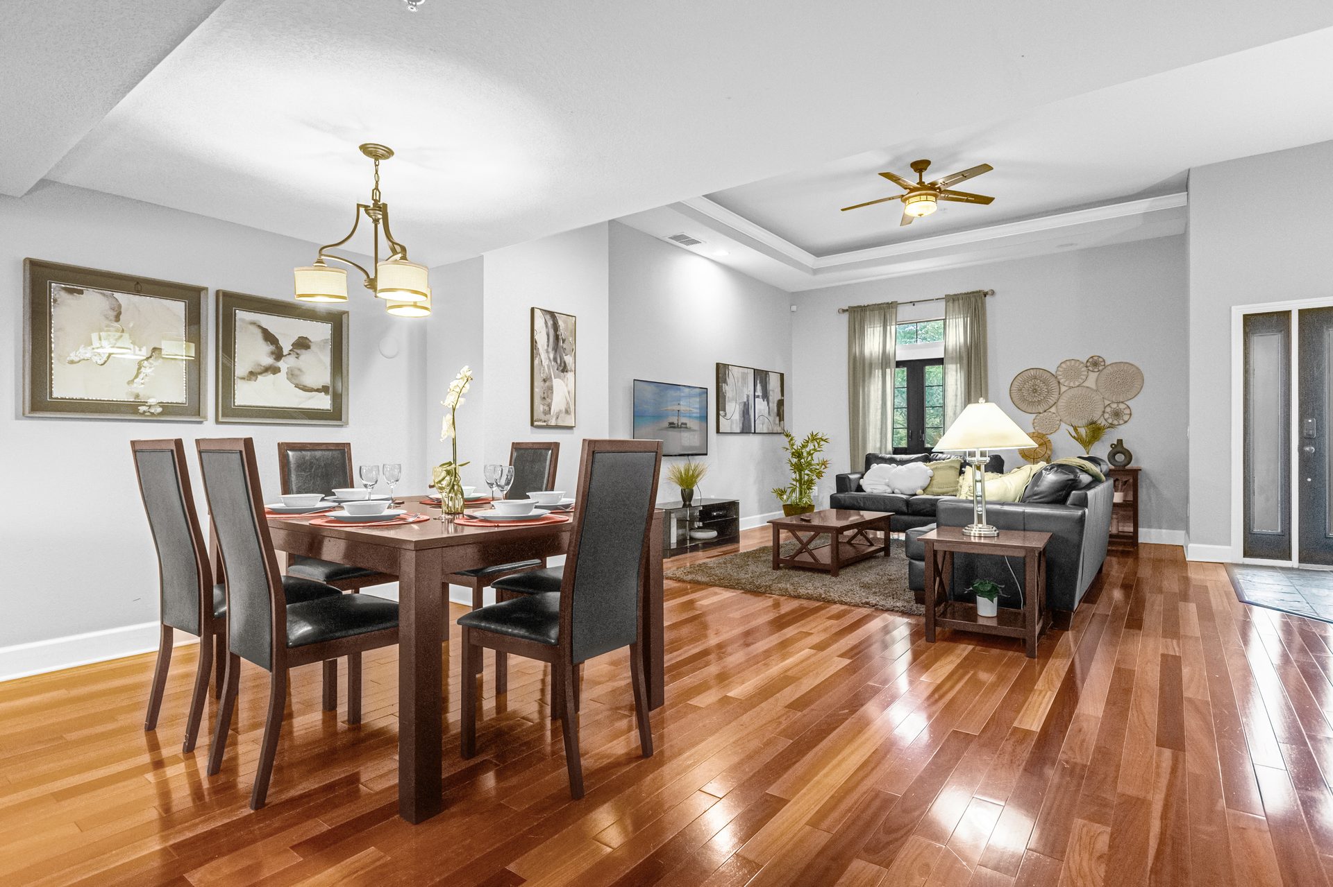 Formal dining area with chandelier, set for six