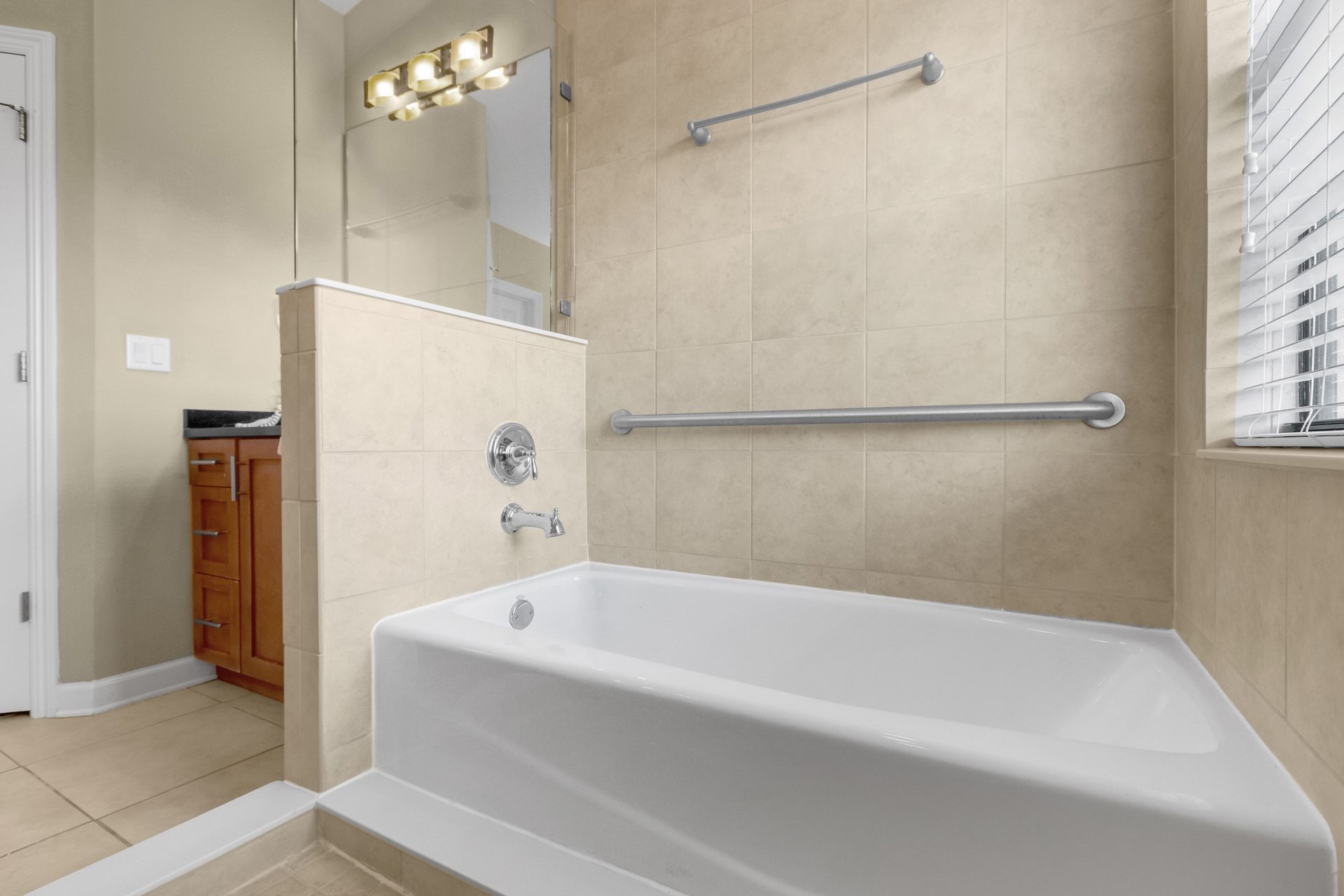 Soaking tub with tile surround and window light